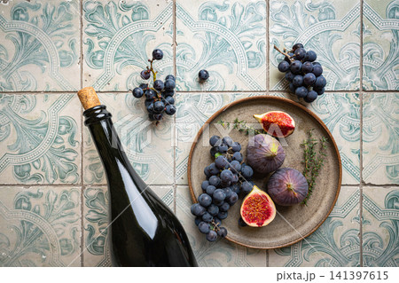 Wine bottle and grapes Wine bottle and grapes 141397615