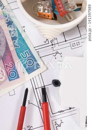 Electrical components with work tools, drawings of electric installation and polish currency Electrical components with work tools, drawings of electric installation and polish currency 141397989