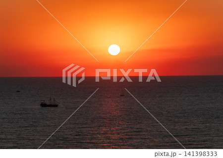 Beautiful red and orange sunrise over the sea. Beautiful red and orange sunrise over the sea. 141398333
