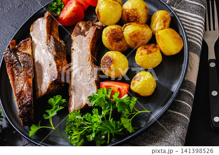 Eastern European Roasted Pork Ribs with potatoes Eastern European Roasted Pork Ribs with potatoes 141398526