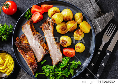 American Backyard Grilled Pork Ribs with potatoes 141398532