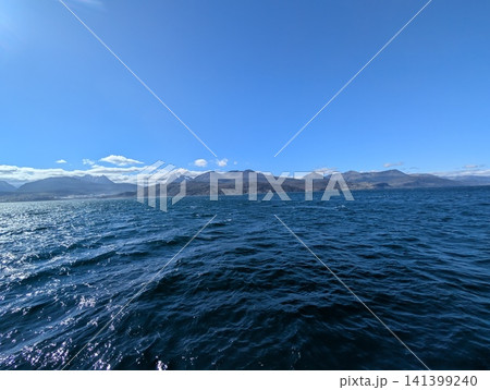 Ushuaia, Argentina - March 6, 2026: Low Island and Snowy Peaks Across the Beagle Channel Ushuaia, Argentina - March 6, 2026: Low Island and Snowy Peaks Across the Beagle Channel 141399240