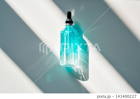 Skincare serum dropper bottle in sunlight Skincare serum dropper bottle in sunlight 141400227