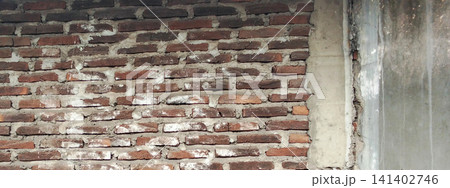 Texture of an old brick wall and plaster-coated concrete. Texture of an old brick wall and plaster-coated concrete. 141402746