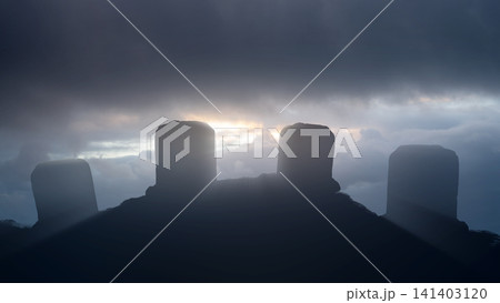 The dramatic silhouette of ancient standing stones against a moody, cloudy sunset sky, evoking a sense of history, mystery, and timelessness. Horror or Halloween background The dramatic silhouette of ancient standing stones against a moody, cloudy sunset sky, evoking a sense of history, mystery, and timelessness. Horror or Halloween background 141403120