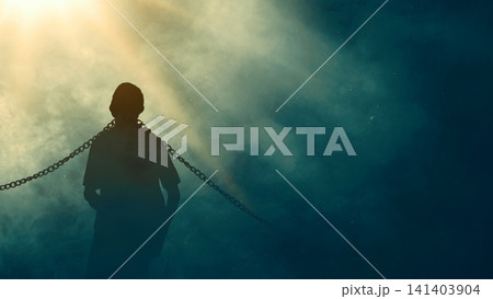 Dramatic silhouette of a man bound by chains looking up toward a powerful divine light, symbolizing hope, liberation, salvation, and breaking free from captivity Dramatic silhouette of a man bound by chains looking up toward a powerful divine light, symbolizing hope, liberation, salvation, and breaking free from captivity 141403904
