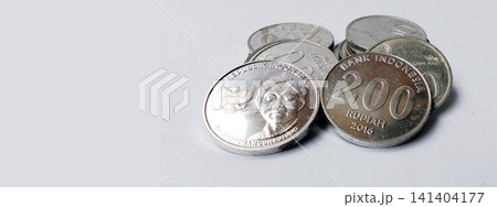 Close-up photo of a stack of Indonesian Rupiah coins with copy space. Close-up photo of a stack of Indonesian Rupiah coins with copy space. 141404177