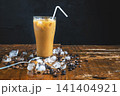 ice coffee on a wooden table 141404921