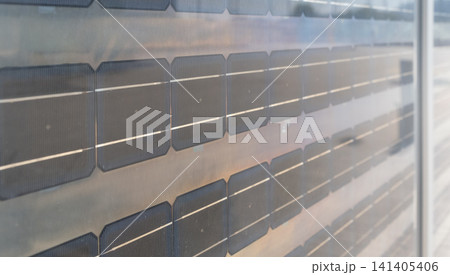 Close-up of solar panels showcasing grid pattern photovoltaic cells for renewable energy solutions. Close-up of solar panels showcasing grid pattern photovoltaic cells for renewable energy solutions. 141405406