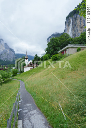 Scenic View of Lauterbrunnen Village with Staubbach Falls and Swiss Alps, Bernese Oberland in the canton of Bern, Switzerland. Picturesque Alpine Landscape and Famous Europe Travel Destination Scenic View of Lauterbrunnen Village with Staubbach Falls and Swiss Alps, Bernese Oberland in the canton of Bern, Switzerland. Picturesque Alpine Landscape and Famous Europe Travel Destination 141405464