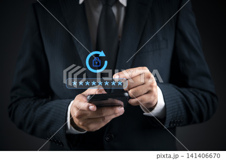 Businessman hand using smartphone with virtual password reset icon. Concept of changing password, account recovery, security update, and cyber hygiene. Businessman hand using smartphone with virtual password reset icon. Concept of changing password, account recovery, security update, and cyber hygiene. 141406670