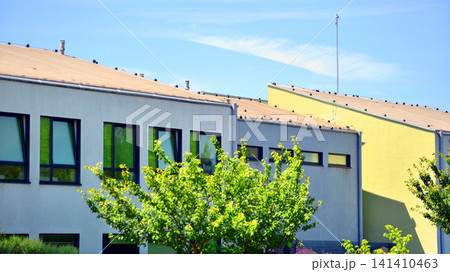 Eco building in modern city concept. Fresh green trees and office building, business concept. Eco building in modern city concept. Fresh green trees and office building, business concept. 141410463