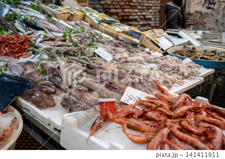 Naples, italy. December 29, 2024. Market stall in naples, italy, with an abundant selection of fresh seafood including shrimp, squid, octopus, and various fish Naples, italy. December 29, 2024. Market stall in naples, italy, with an abundant selection of fresh seafood including shrimp, squid, octopus, and various fish 141411911