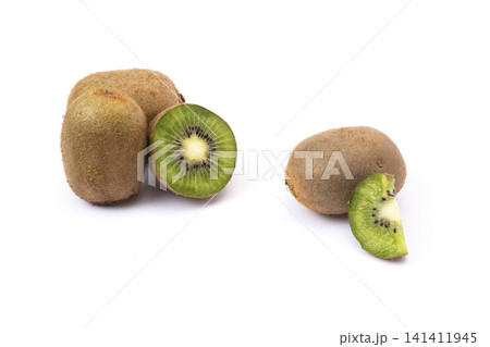Ripe whole kiwi fruit and half kiwi fruit isolated on white background. Kiwi fruit close-up isolated on a white background Ripe whole kiwi fruit and half kiwi fruit isolated on white background. Kiwi fruit close-up isolated on a white background 141411945