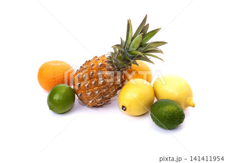 Pineapple with lemon and lime and oranges on a white background. Group of citrus fruits close-up. Lime green, pineapple, orange orange, lemon close-up on an isolated white background. Pineapple with lemon and lime and oranges on a white background. Group of citrus fruits close-up. Lime green, pineapple, orange orange, lemon close-up on an isolated white background. 141411954