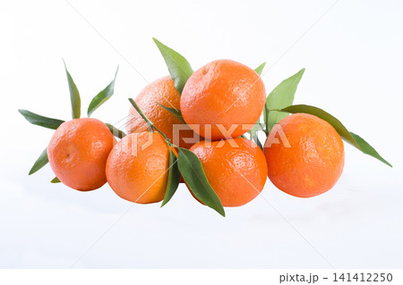 The fresh mandarines isolated on white background. The fresh mandarines isolated on white background. 141412250