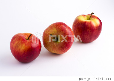 Apples on a white background. A group of apples on an isolated white background. Fruits on a white background. Apples on a white background. A group of apples on an isolated white background. Fruits on a white background. 141412444