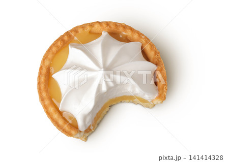 bitten off tartlet with lemon cream and meringue isolated on white background. Top view. Flat lay. bitten off tartlet with lemon cream and meringue isolated on white background. Top view. Flat lay. 141414328
