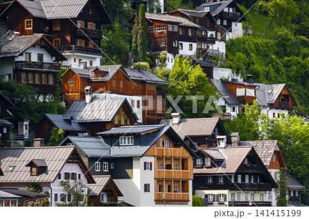 Classic alpine houses in Hallstatt village, illustrating authentic landscape with European charm and scenic rural atmosphere. Classic alpine houses in Hallstatt village, illustrating authentic landscape with European charm and scenic rural atmosphere. 141415199