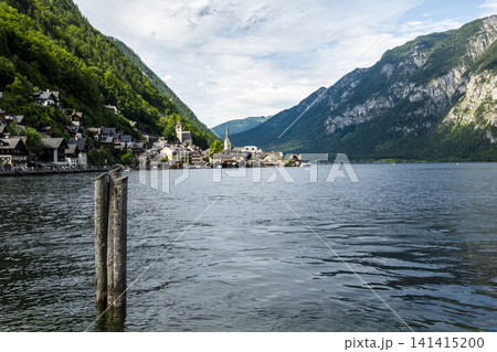 Hallstatt village and scenic lakeside in the Austrian Alps, illustrating European small town charm with classic summer atmosphere. Hallstatt village and scenic lakeside in the Austrian Alps, illustrating European small town charm with classic summer atmosphere. 141415200
