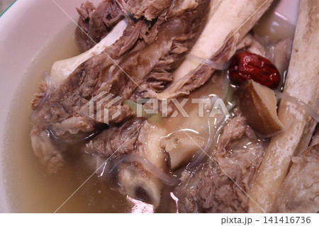 Bowl of Meat Soup with Bones and Ingredients Bowl of Meat Soup with Bones and Ingredients 141416736