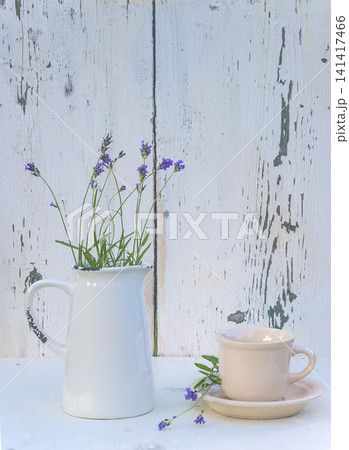 cup of tea and lavender flowers on a white background cup of tea and lavender flowers on a white background 141417466