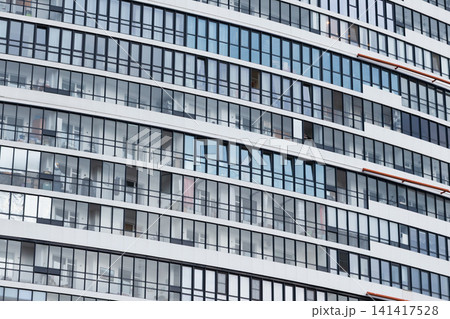 A curved modern apartment building facade A curved modern apartment building facade 141417528