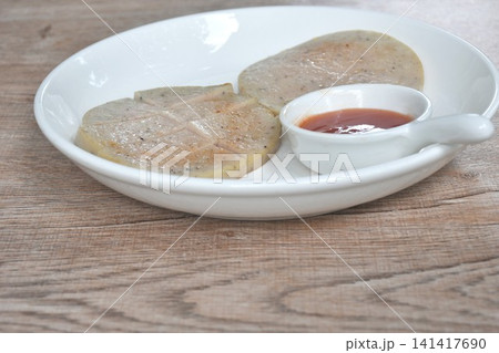 slice fried mashed pork sausage Vietnamese style dipping spicy chili sauce on plate slice fried mashed pork sausage Vietnamese style dipping spicy chili sauce on plate 141417690