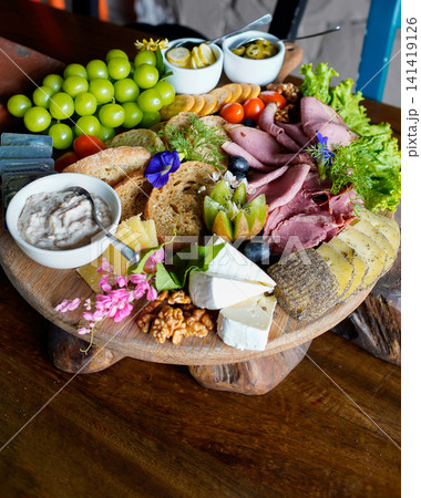 Colorful Gourmet Cheese Platter with Artisan Cheese, Roast Beef and Fresh Fruits Colorful Gourmet Cheese Platter with Artisan Cheese, Roast Beef and Fresh Fruits 141419126