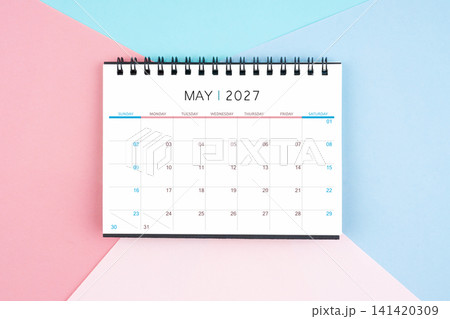 May month desk calendar for 2027 year on colorful background. Flat lay. May month desk calendar for 2027 year on colorful background. Flat lay. 141420309