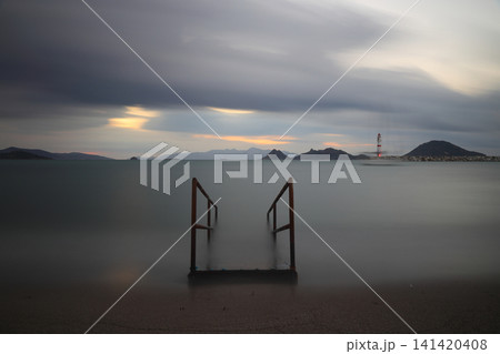 sunset on the beach. Seaside town of Turgutreis and spectacular sunsets. Selective Focus. Long Exposure shoot. tranquility scene. sunset on the beach. Seaside town of Turgutreis and spectacular sunsets. Selective Focus. Long Exposure shoot. tranquility scene. 141420408