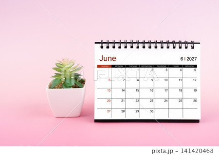 June 2027, Monthly desk calendar for 2027 year on pink background. June 2027, Monthly desk calendar for 2027 year on pink background. 141420468