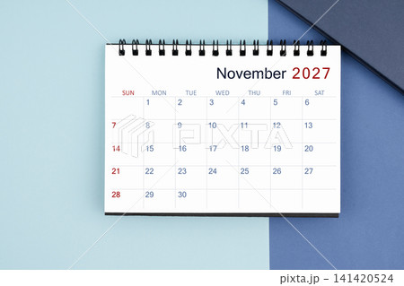 November 2027 monthly desk calendar for 2025 year on blue background. 141420524