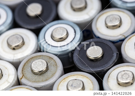 Detailed Macro Close-Up of Multiple Used and Worn Alkaline Cylindrical Batteries Grouped Together Showing Positive Metal Terminal Nubs in Various Conditions Detailed Macro Close-Up of Multiple Used and Worn Alkaline Cylindrical Batteries Grouped Together Showing Positive Metal Terminal Nubs in Various Conditions 141422026