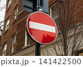 Red no entry traffic sign on an urban street 141422500