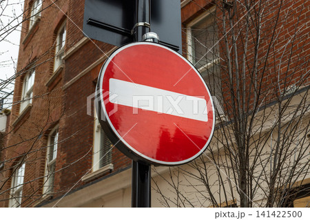 Red no entry traffic sign on an urban street 141422500