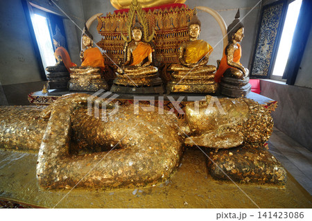 "Luang Pho Phra Non," in Wat Phra Non temple a stone-carved Buddha image in the reclining posture. Its appearance is unique compared to others: it is a Buddha image lying on its back. "Luang Pho Phra Non," in Wat Phra Non temple a stone-carved Buddha image in the reclining posture. Its appearance is unique compared to others: it is a Buddha image lying on its back. 141423086