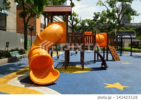 Climbing structures and slides are playground equipment for children, which are part of the public park in Bangkok capital city , Thailand. Climbing structures and slides are playground equipment for children, which are part of the public park in Bangkok capital city , Thailand. 141423128