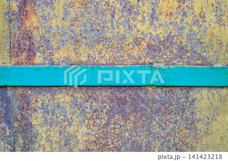 Rusted metal plate texture with green horizontal metal stripe. Weathered iron surface and vintage corrosion material background. 141423218