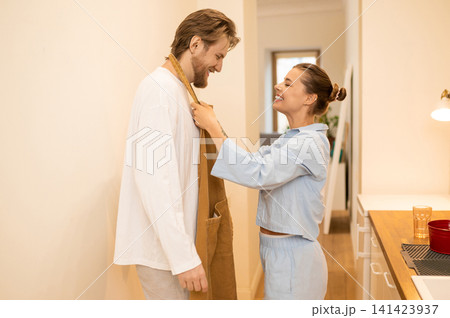 Cute young couple in the kitchen feeling excited and happy Cute young couple in the kitchen feeling excited and happy 141423937