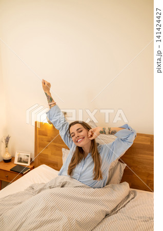 Young woman feeling sleepy and unrested in the morning Young woman feeling sleepy and unrested in the morning 141424427