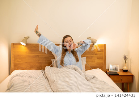 Young woman feeling sleepy and unrested in the morning Young woman feeling sleepy and unrested in the morning 141424433