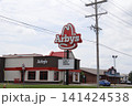 Arby's Fast Food Restaurant with blue sky and clouds Arby's Fast Food Restaurant with blue sky and clouds 141424538