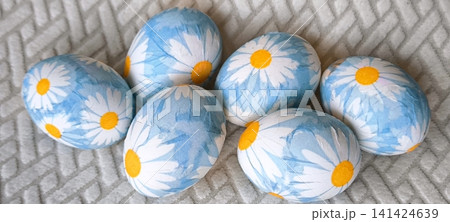 Group of Easter eggs with floral print on light background Group of Easter eggs with floral print on light background 141424639