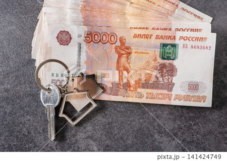 House keys with Russian ruble banknotes for home purchase concept House keys with Russian ruble banknotes for home purchase concept 141424749