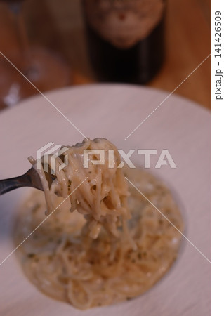 Creamy Pasta on Fork Close-Up Creamy Pasta on Fork Close-Up 141426509