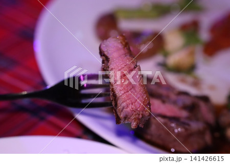 Medium-Rare Steak Slice on Fork Medium-Rare Steak Slice on Fork 141426615