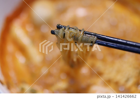 Chopsticks Lifting Noodles from Bowl 141426662