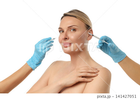 A woman receives a cosmetic injection on her skin, isolated on white, PNG A woman receives a cosmetic injection on her skin, isolated on white, PNG 141427051