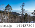 The landscape of mountains at Mongolian border looking through lake Baikal seen from Listvyanka a small town in Irkutsk Oblast on the shores of Lake Baikal, Russia. 141427204